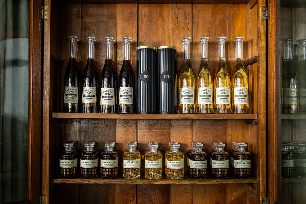 Klocke Estate bottles: Brevis Sweet Red, Brandy 00, Brevis White, and Flyback coctkails